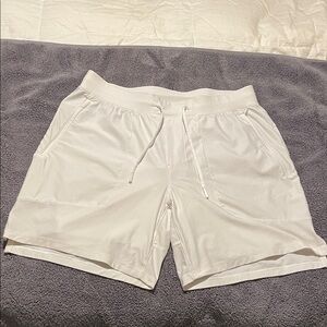 Lululemon License to Train Shorts in the color Bone size Large